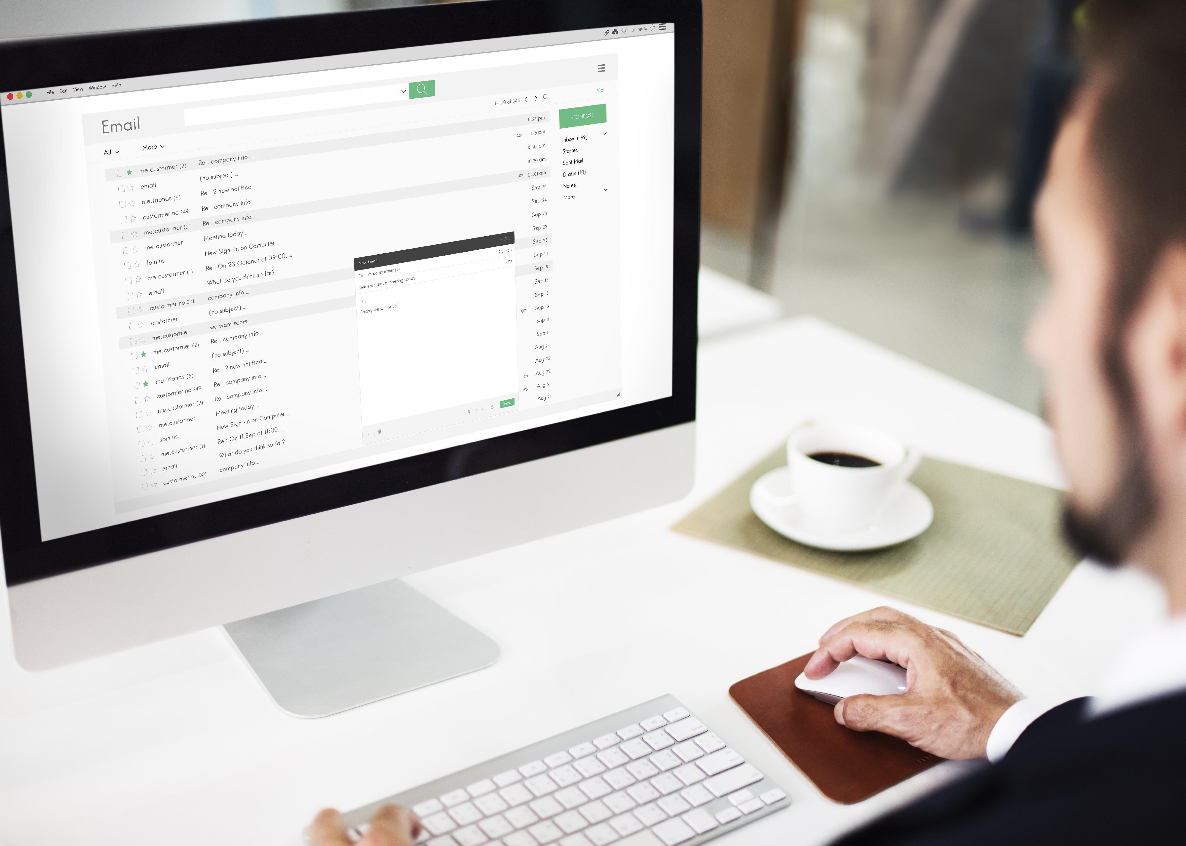 Man looking at email on computer