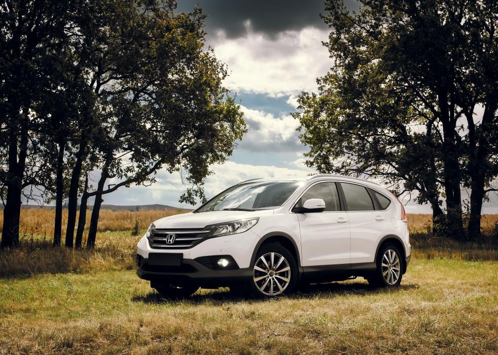 Honda CR-V stands on a countryside road.