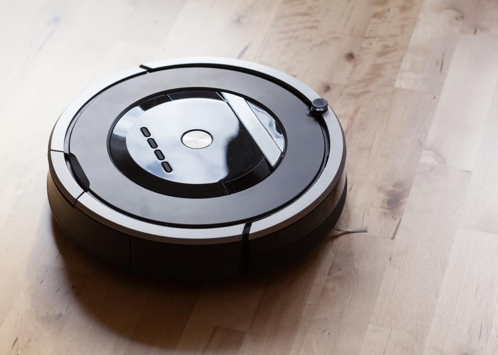Robotic vacuum cleaner on laminate wood floor