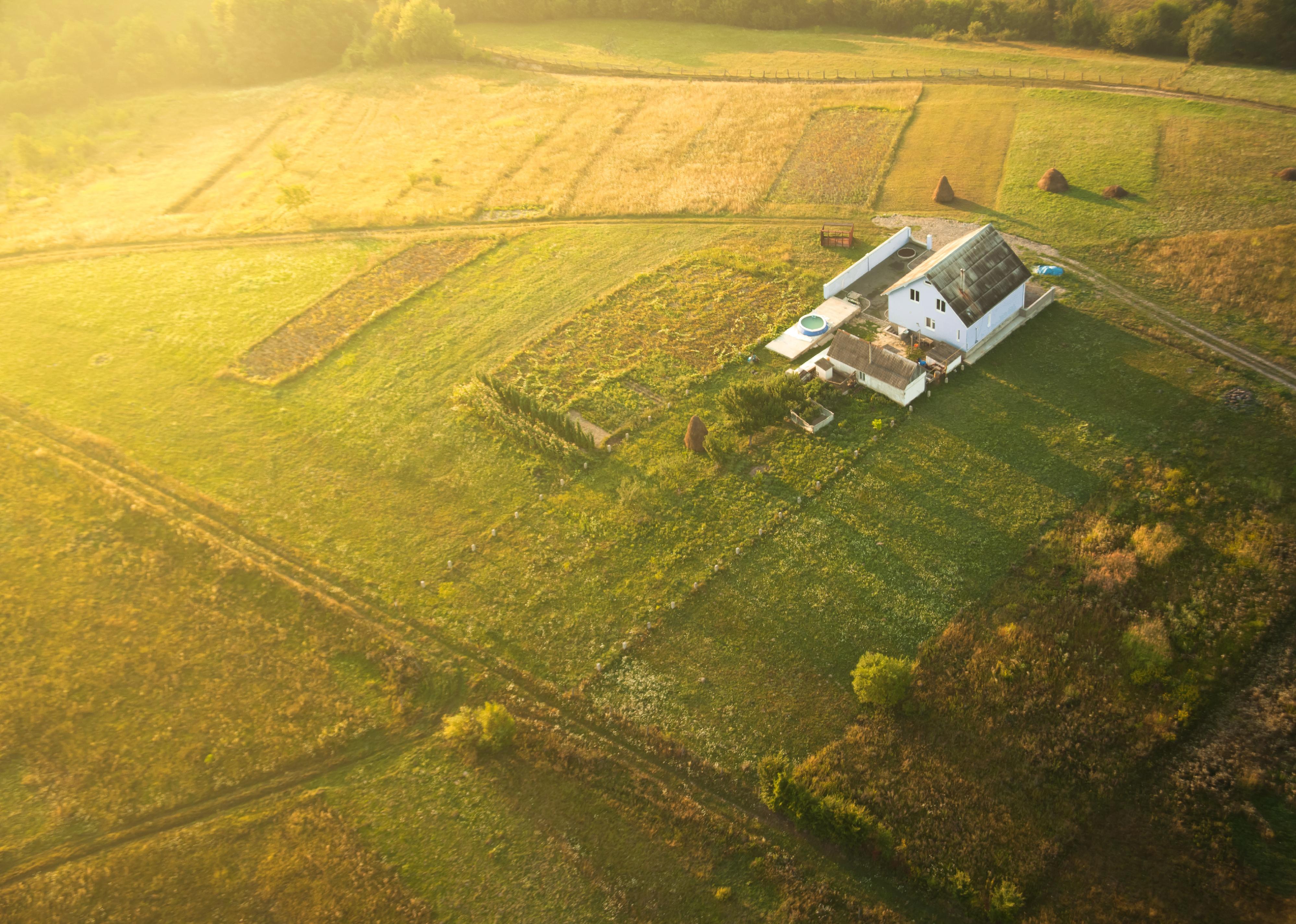 Aerial view of house and farmland.
