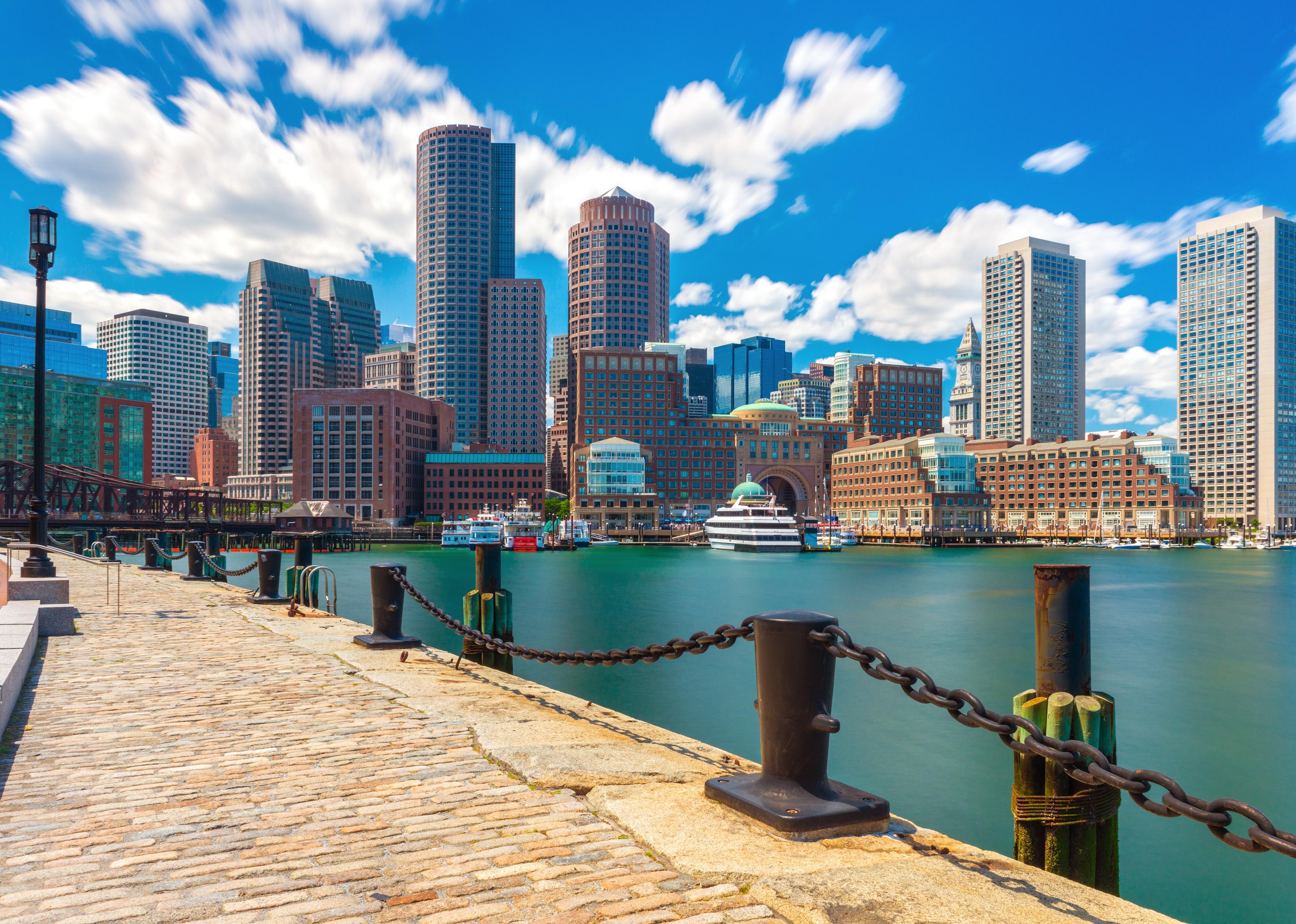 Boston skyline in sunny summer day, view of downtown from harbor.