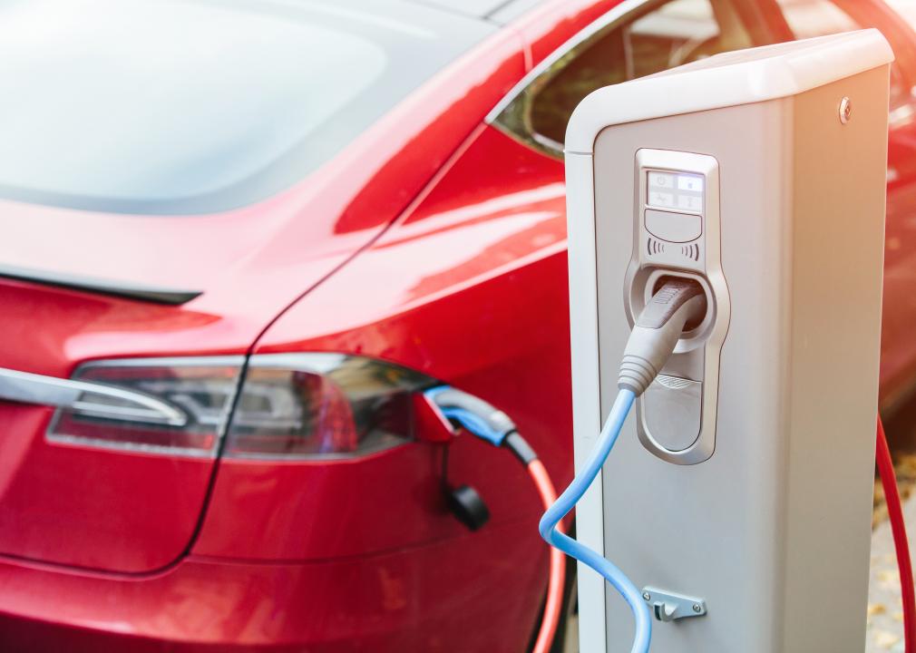 A Tesla car charging at station.