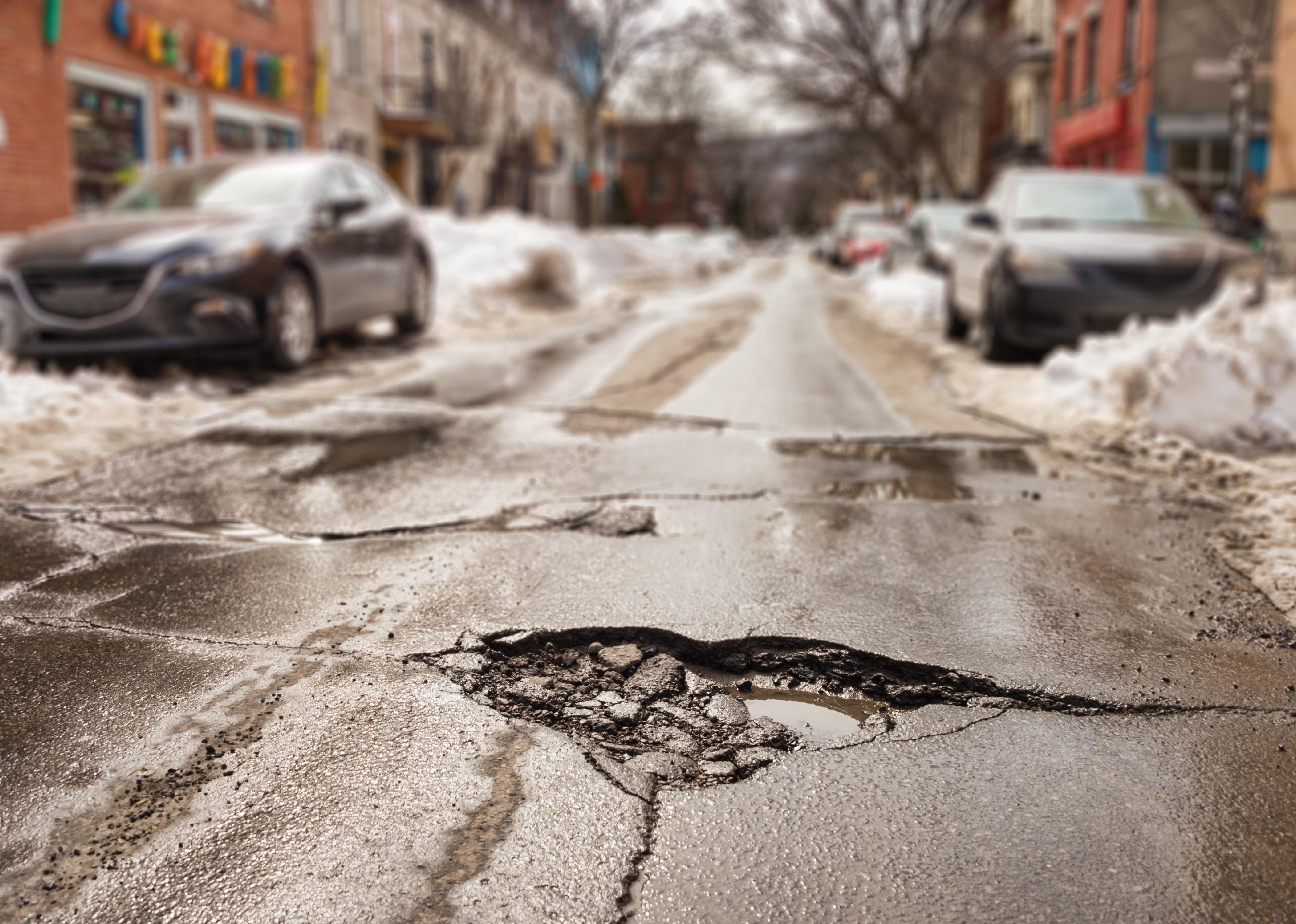 Large pothole in a residential street.