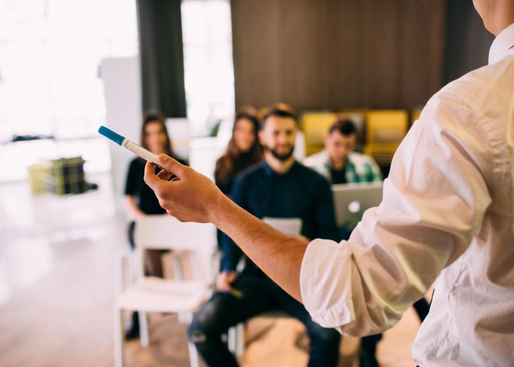 Back view of a lecture and training session in an office.