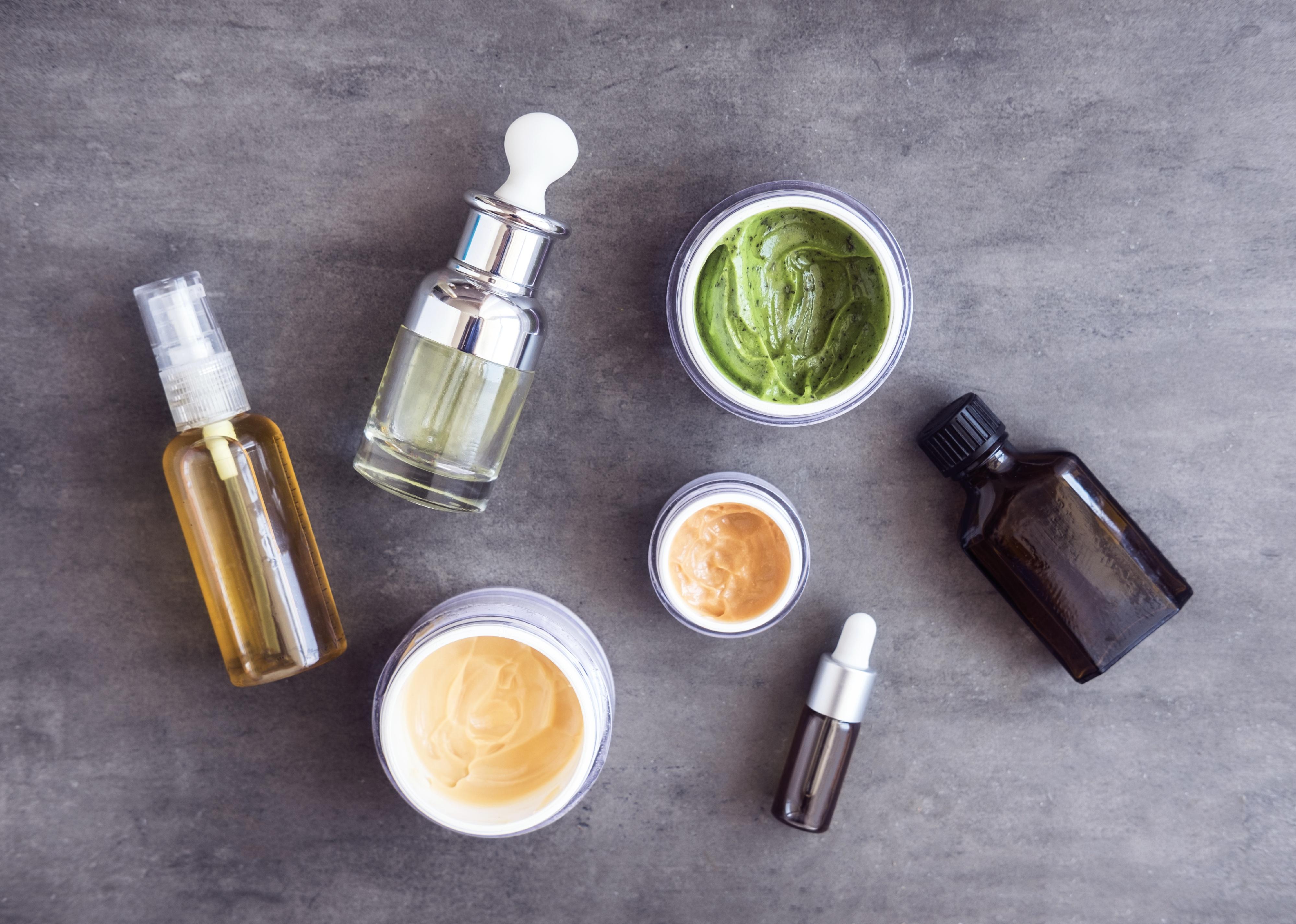 Bottles and jars with skincare cosmetics.