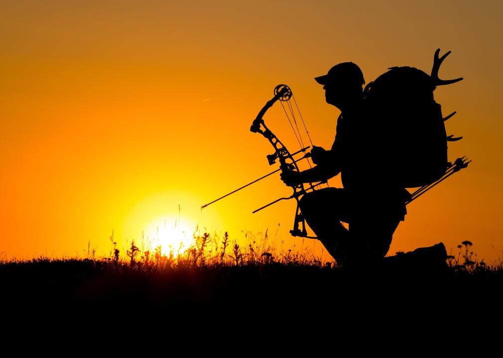 Silhouette of a bow hunter.