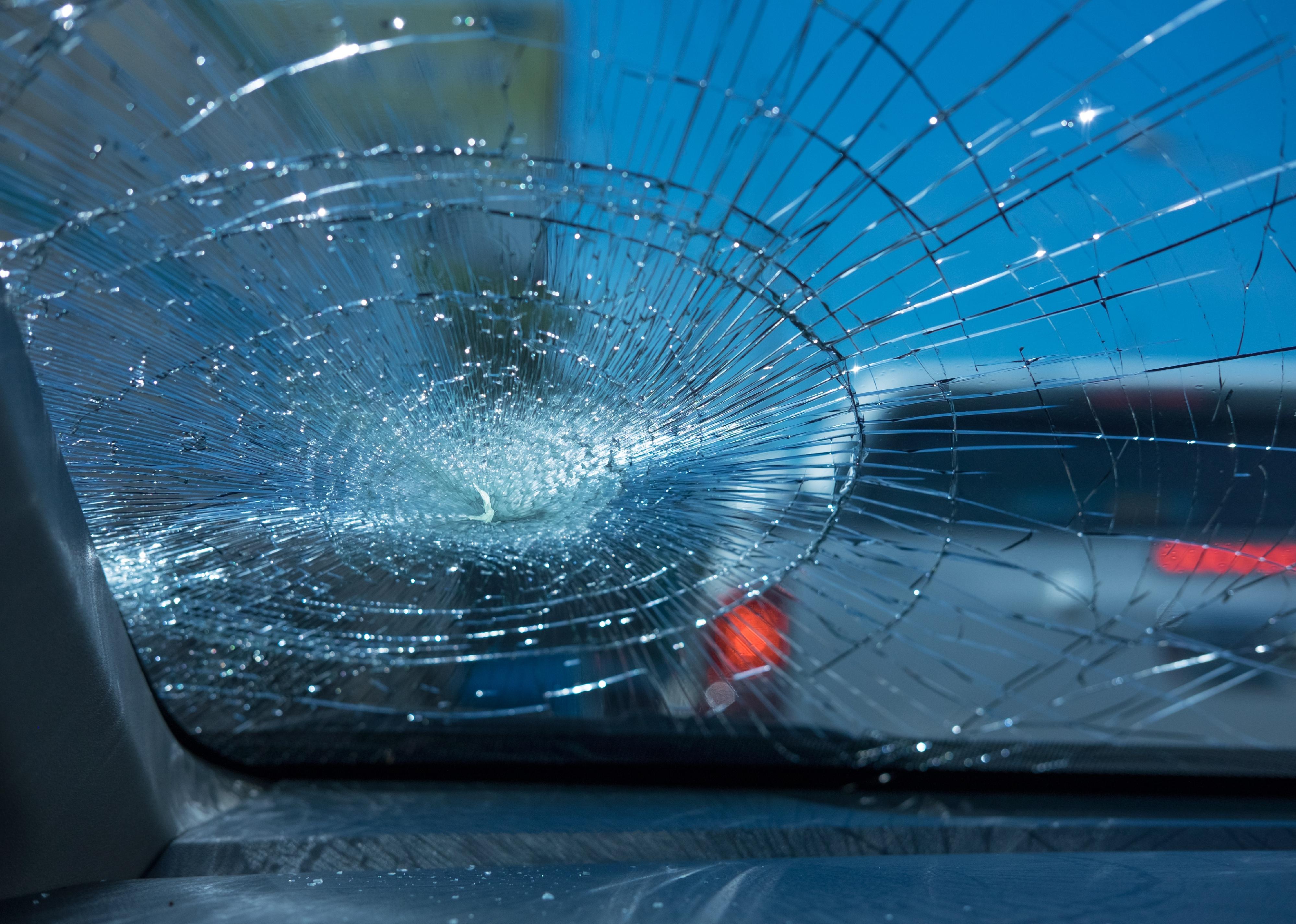 Inside of a car with shattered glass.