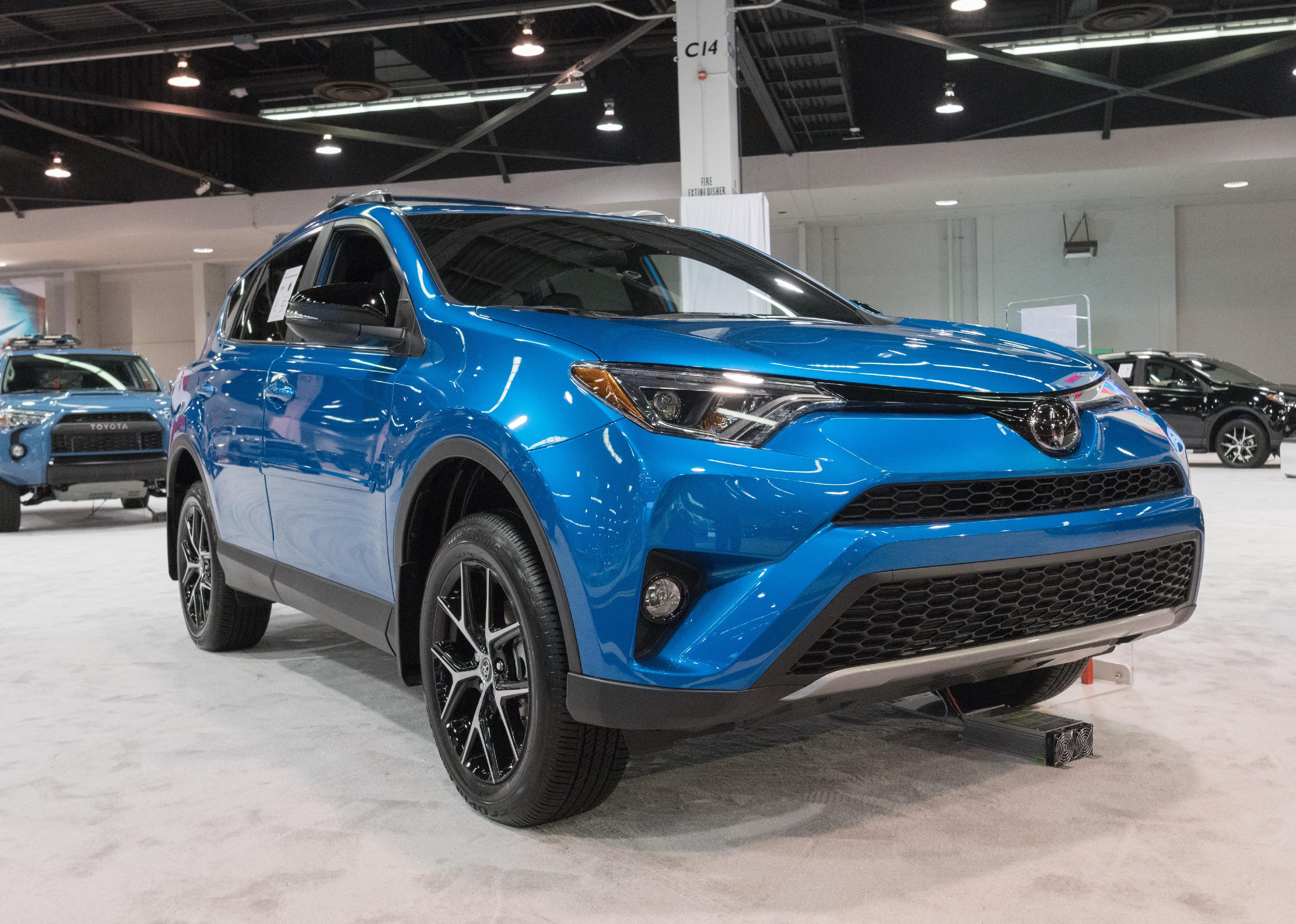 Blue Toyota RAV4 on display at the Orange County International Auto Show.