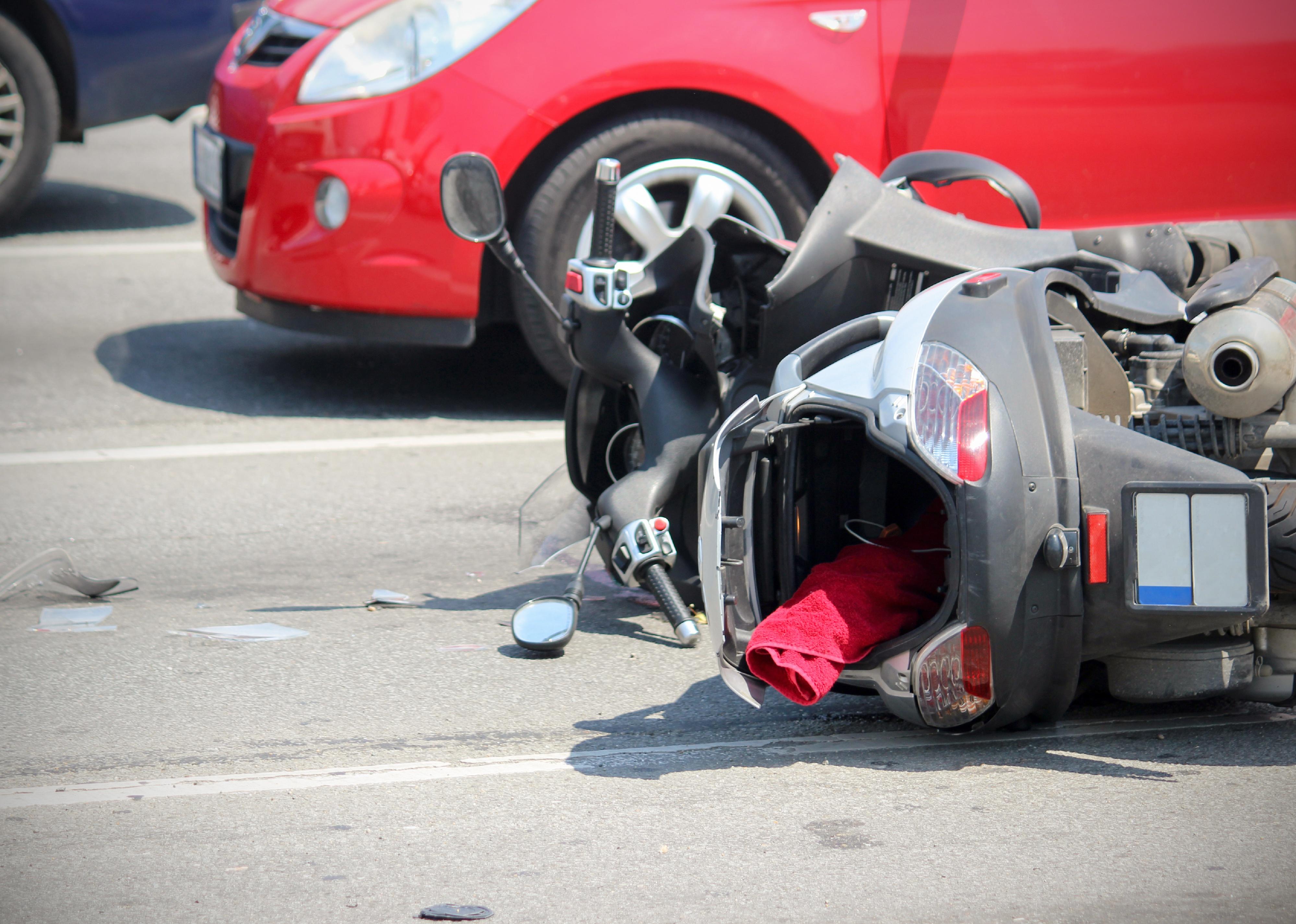 Car accident scene with motor bike.