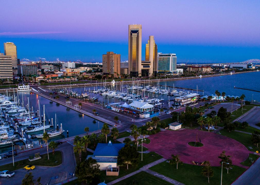 Sunset aerial of marina and buildings.