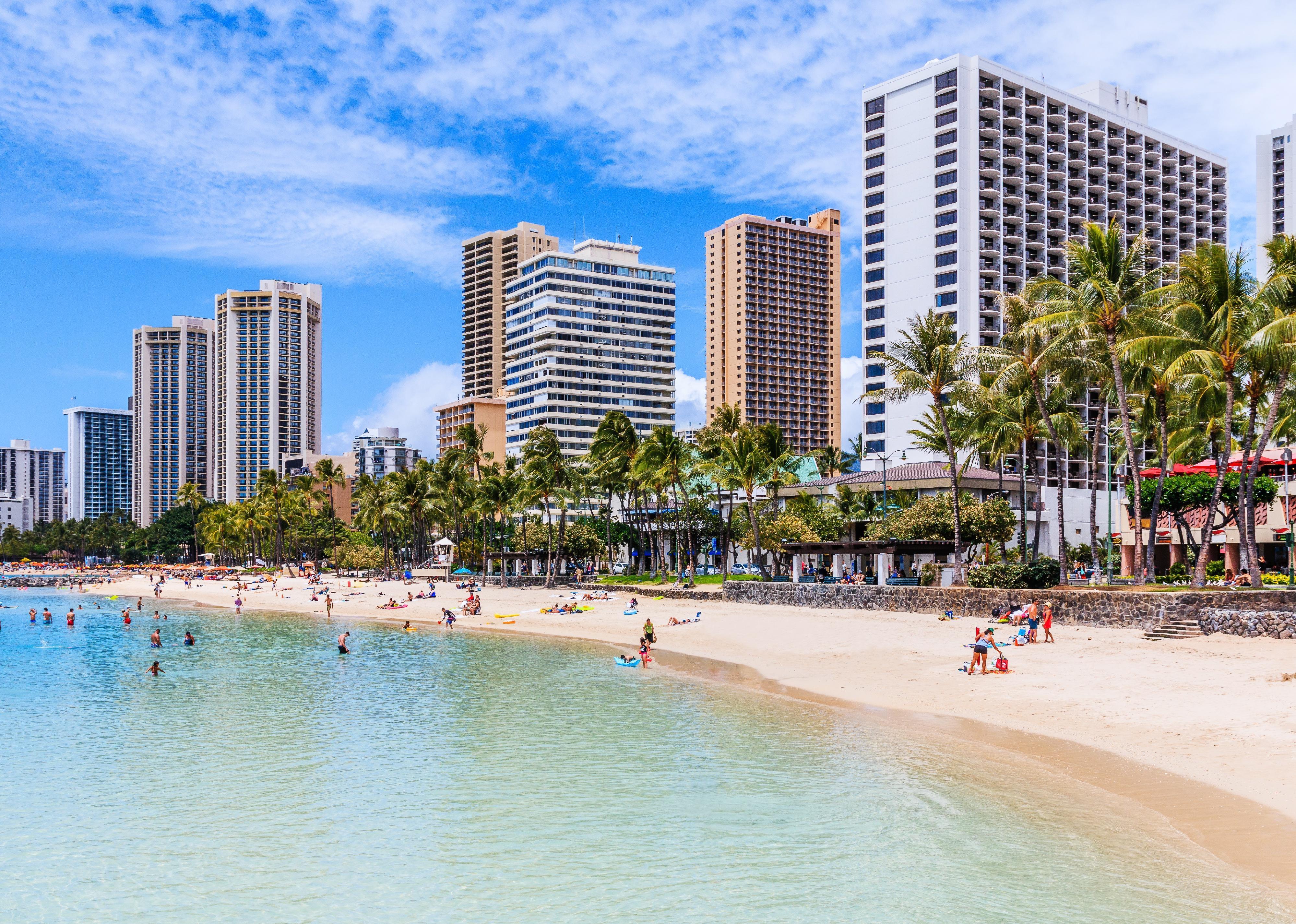 The sun shines on beautiful Waikiki Beach in Honolulu.
