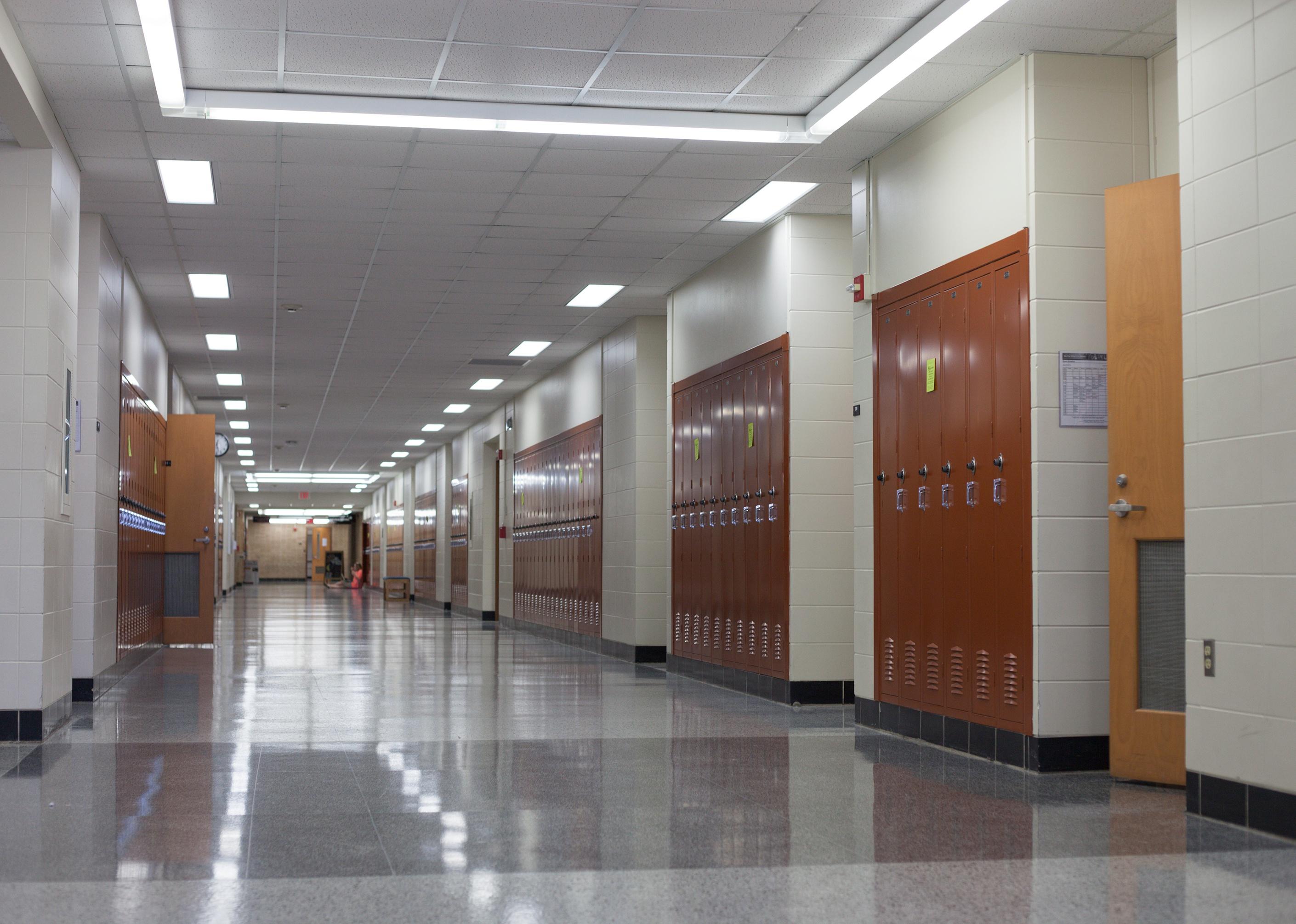 Empty school hallway with lockers.