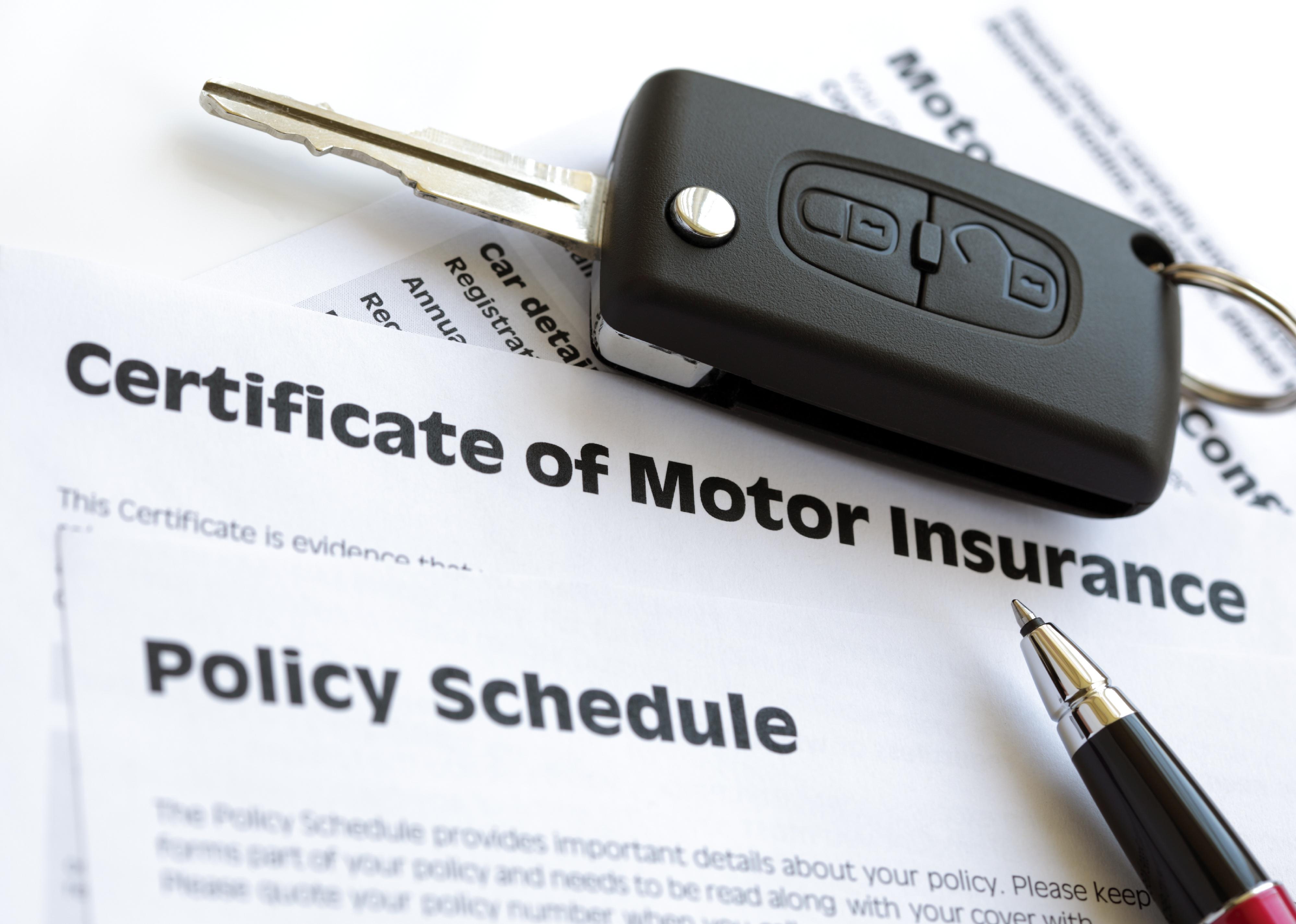 Certificate of motor insurance and policy schedule with car key