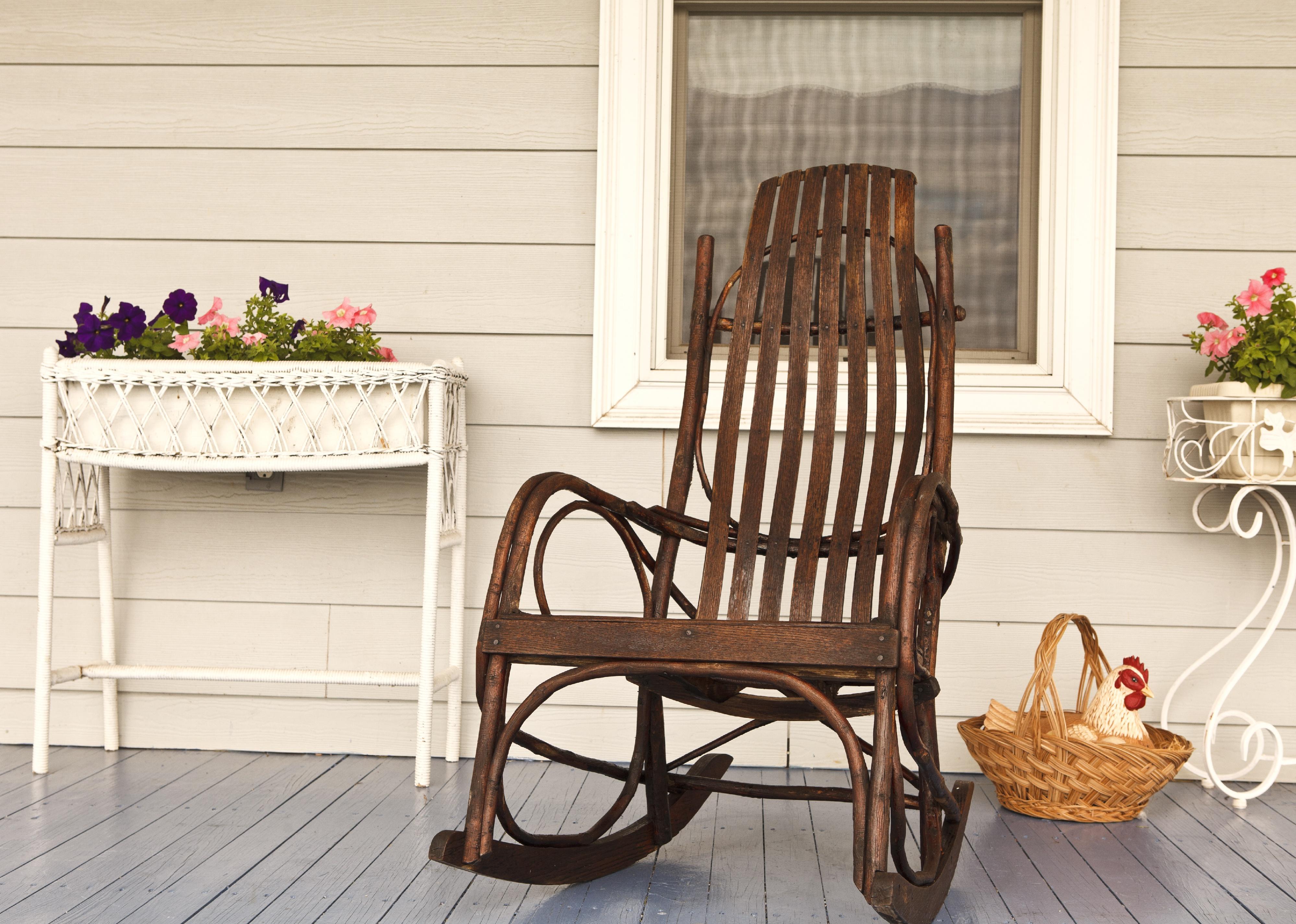 A front porch with a rocking chair.
