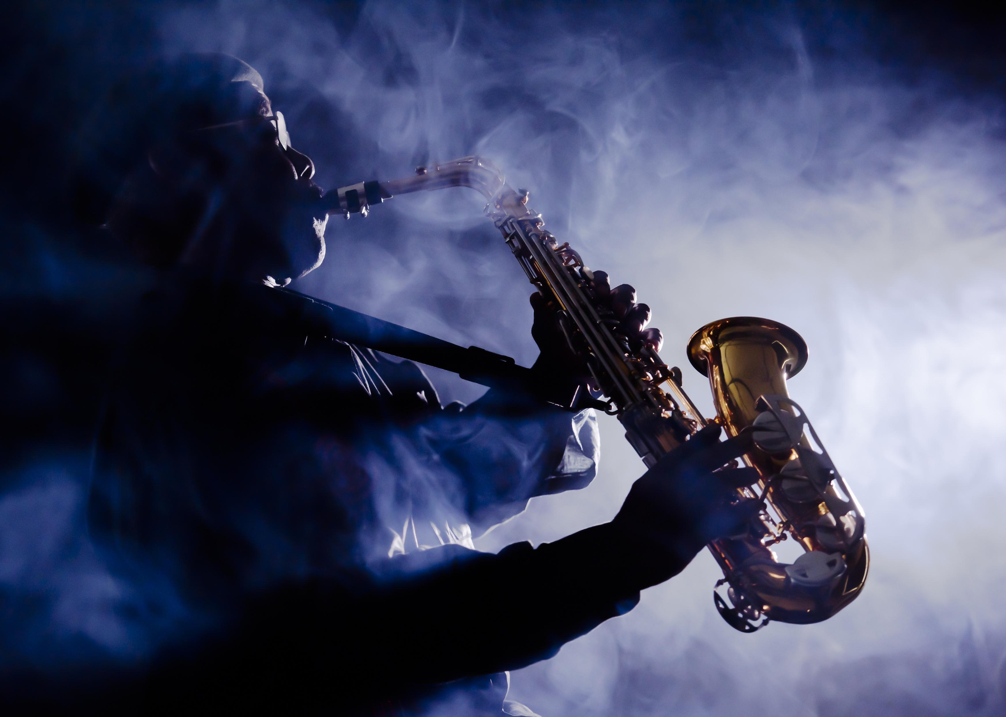 Bill Withers playing the saxophone.