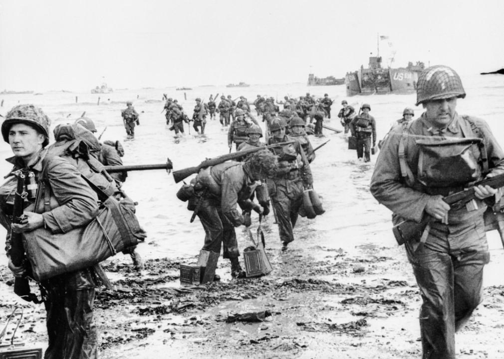 American soldiers help the wounded come to shore during the Allied invasion on June 6, 1944.