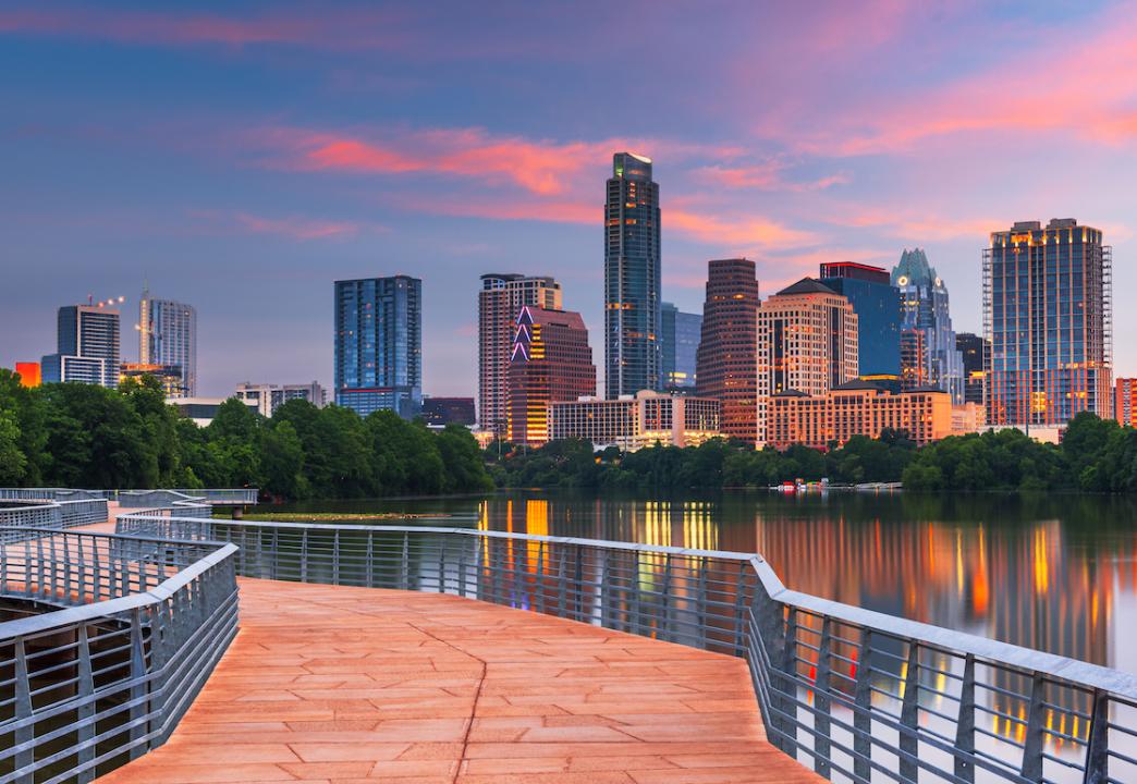 Downtown skyline over the Colorado River at dawn in Austin, Texas.