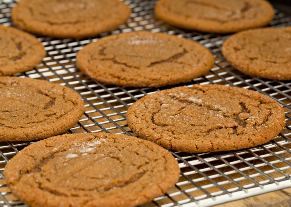 Molasses cookies on a cooling rack.