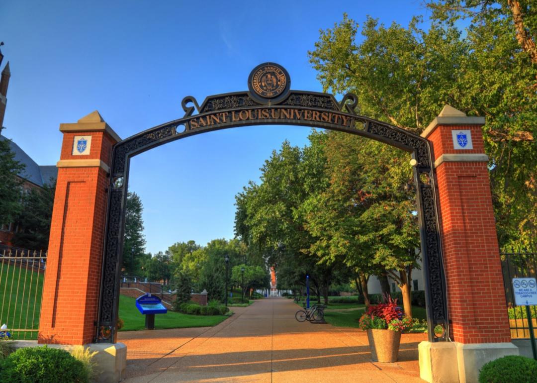 A large brick and iron arch sign for Saint Louis University.