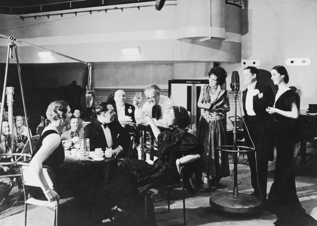 A play being performed in costume at a BBC radio studio in the early 1900.
