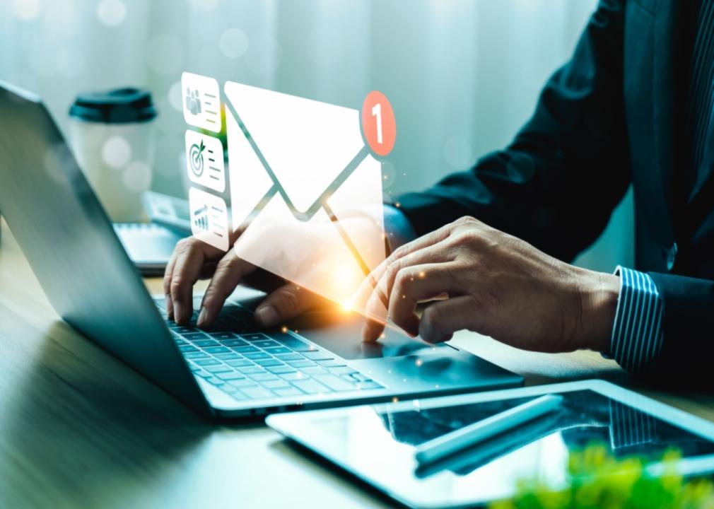 A man checking email on a laptop.