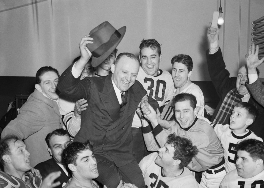 George Halas on the shoulders of his team.