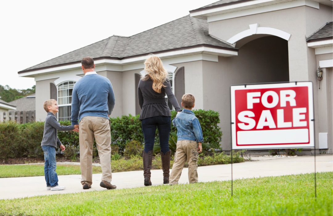 Family looking at house from the exterior with 
