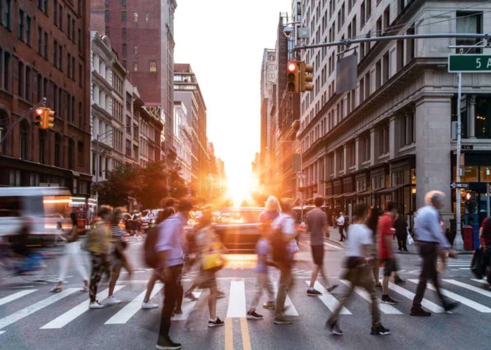 A busy crosswalk in a metro area.
