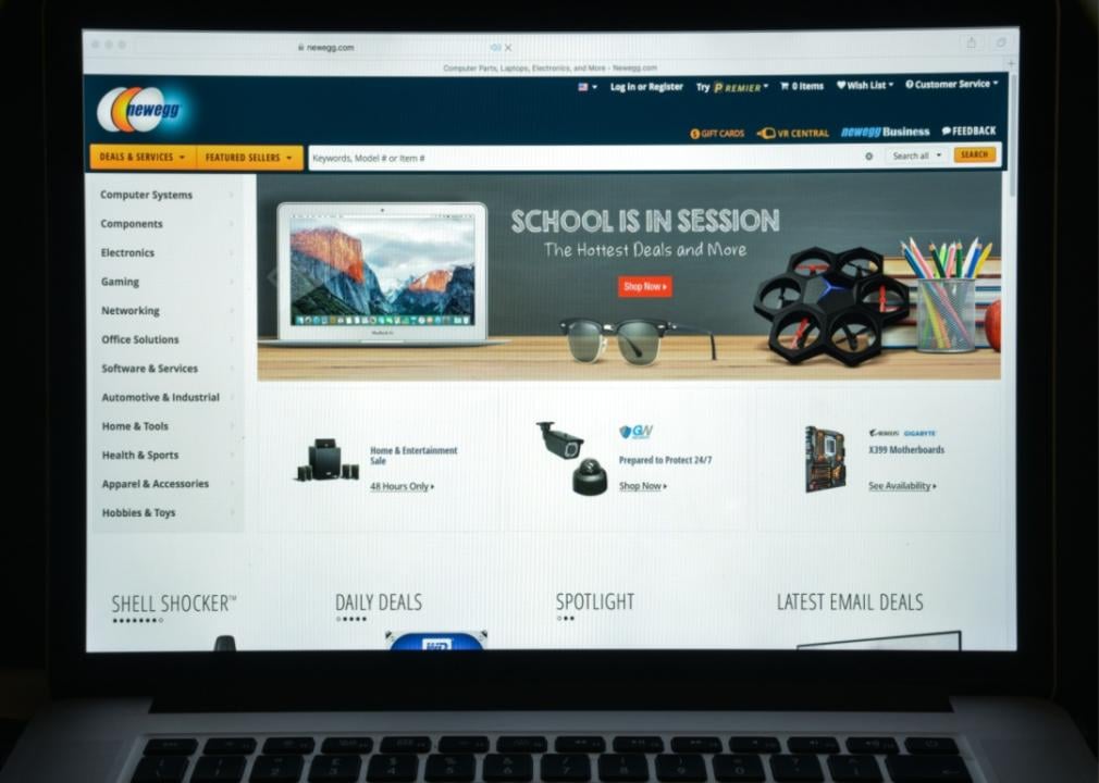 The Newegg website on a laptop screen.