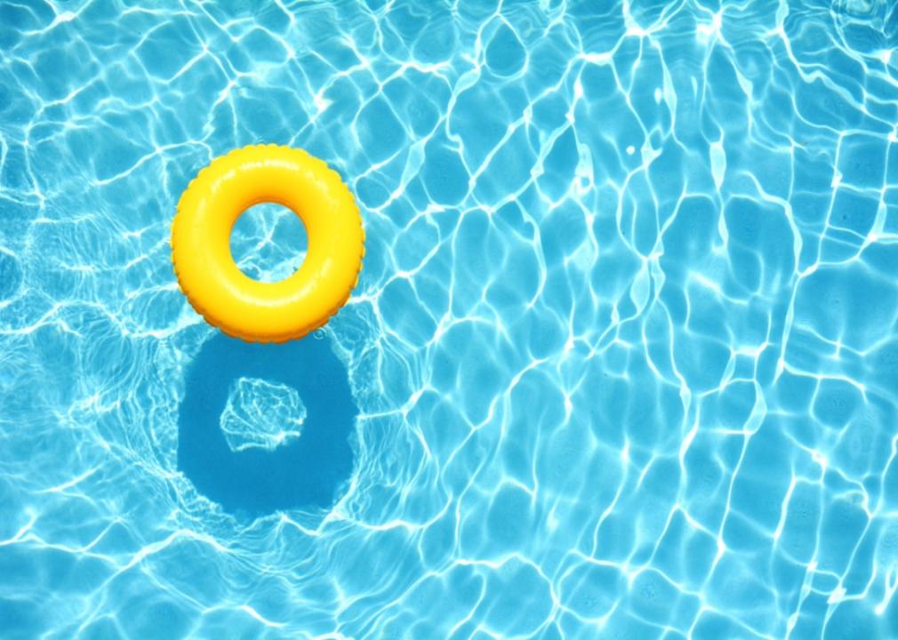 A yellow pool float in a pool.