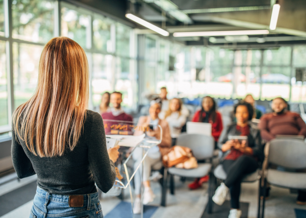 A woman making a presentation in front of a group.