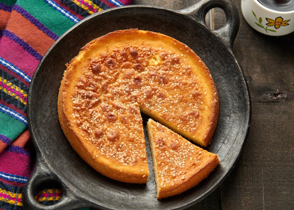 Quesadilla de Queso bread Latin sweet cheese bread dessert in a clay plate.