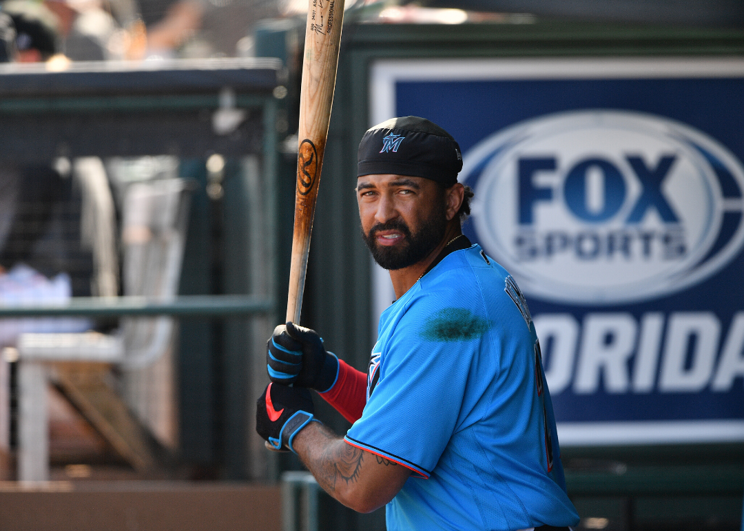 Matt Kemp holds a bat in the dugout.