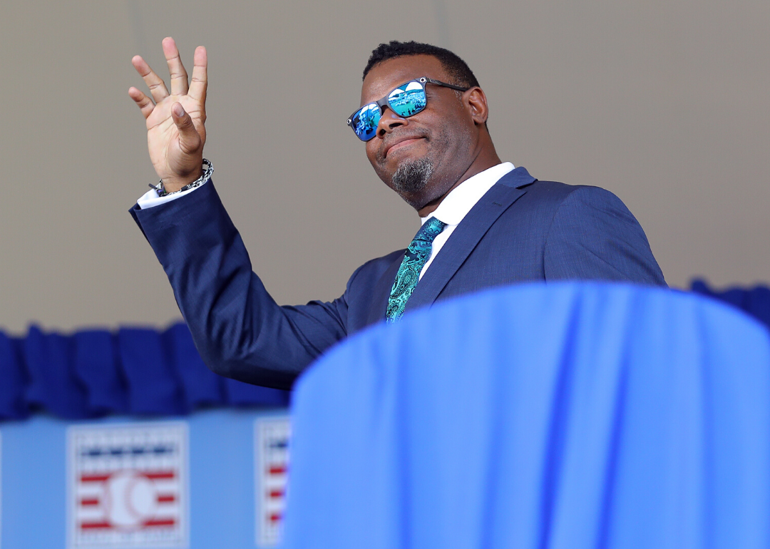 Ken Griffey Jr. waves to fans at a National Baseball Hall of Fame induction ceremony.