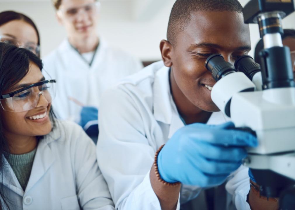 #1. University of Health Sciences and Pharmacy in St. Louis Science students using a microscope.