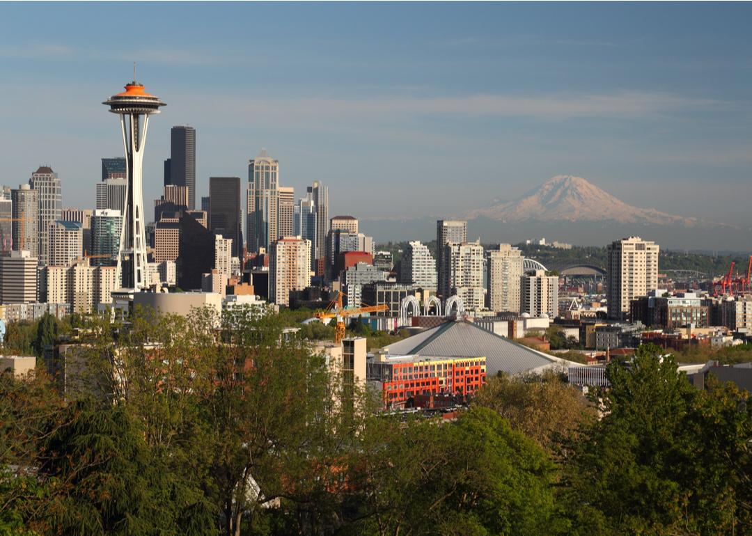The Seattle skyline near sundown, featuring the Space Needle and Mt. Rainier.