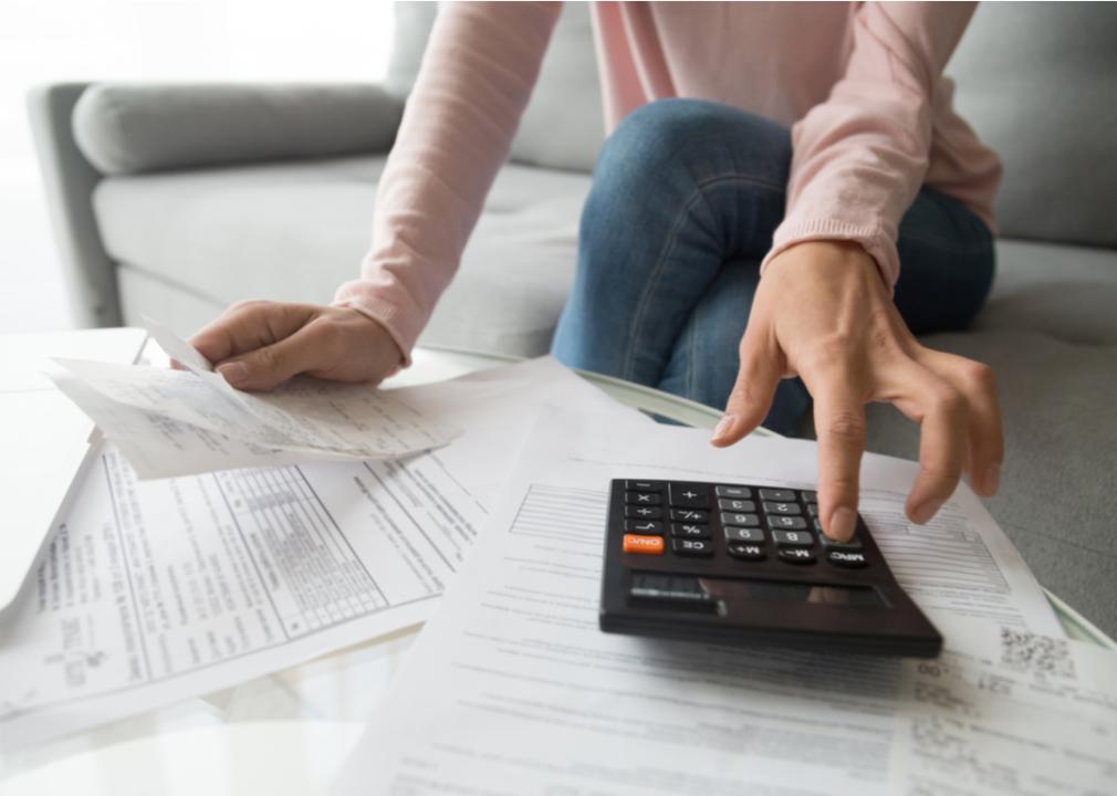 A woman calculating loan payments