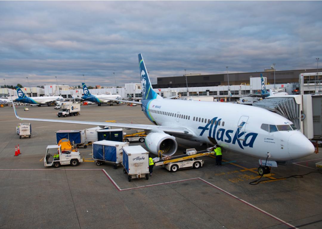 Alaska Airlines Boeing B737-700 N644AS being loaded with luggage at the Seattle Tacoma International Airport.