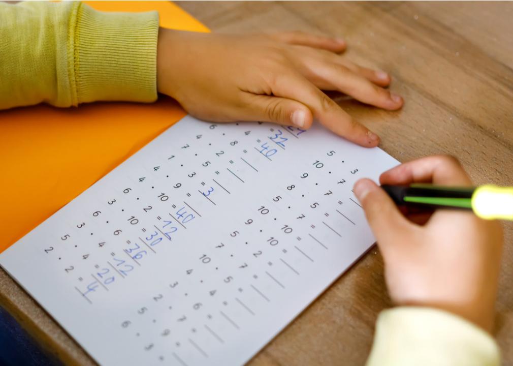 A young student completing their times tables