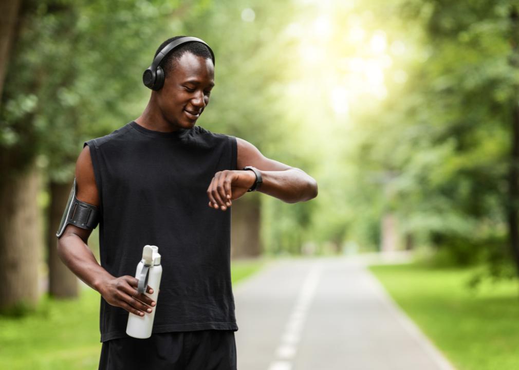 A man checking his smartwatch while working out