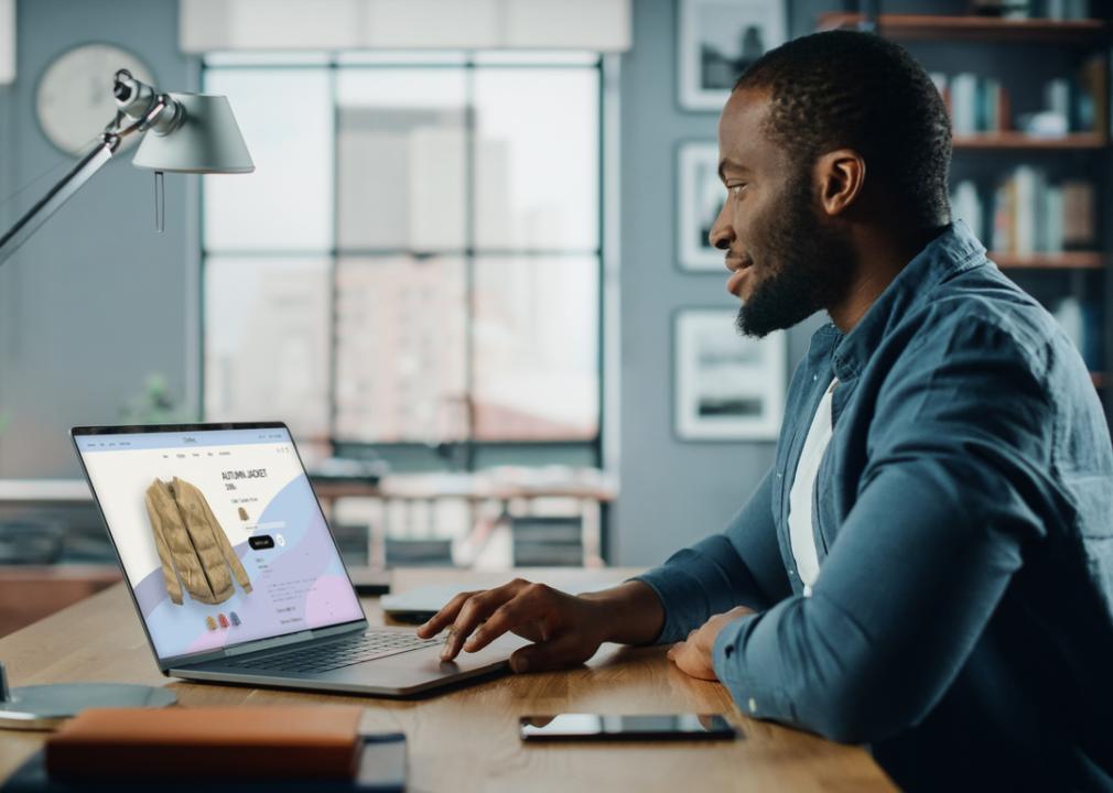 A man shopping for a jacket online