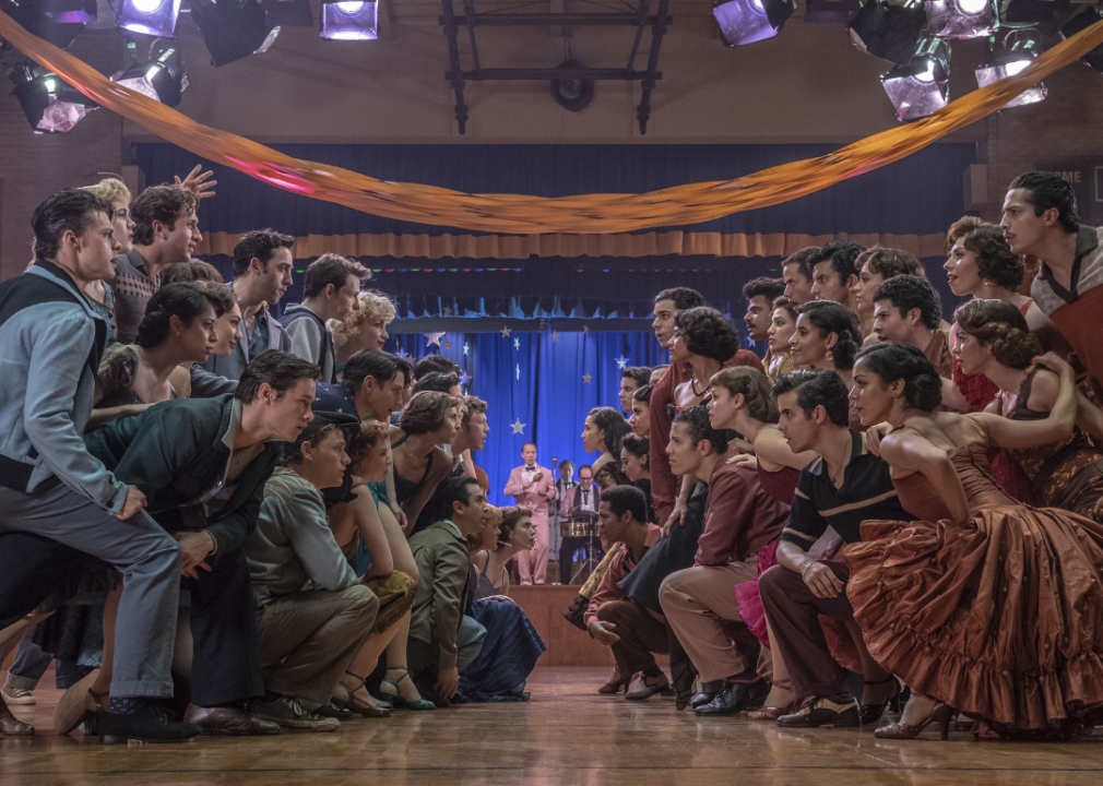 Girls and guys facing each other in a ballroom in the film.