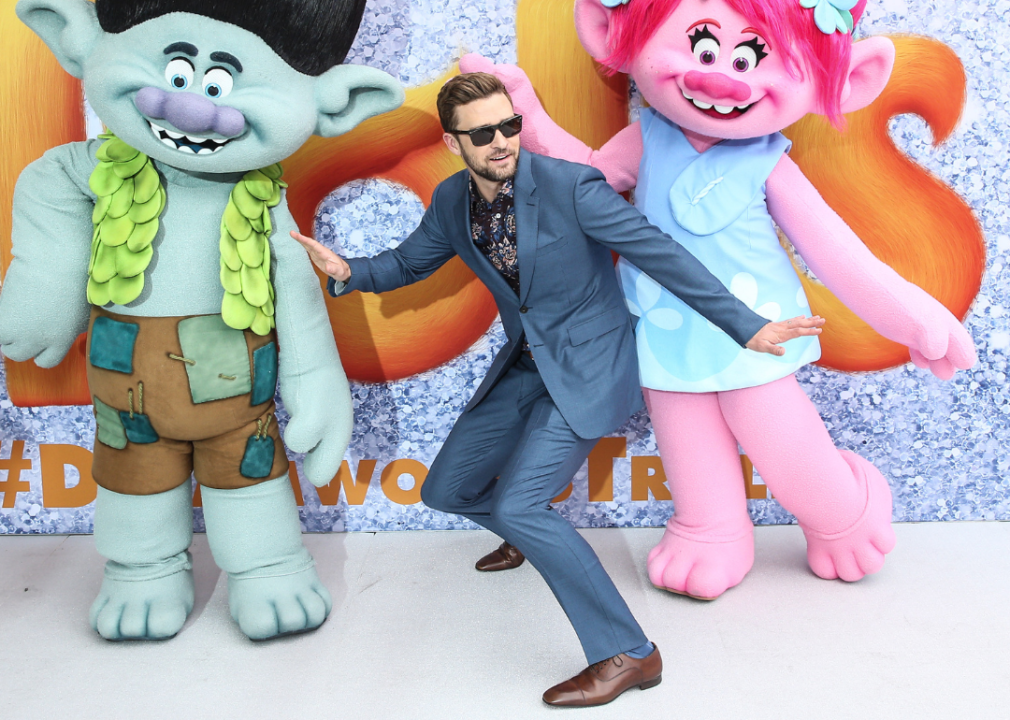 Justin Timberlake posing with Trolls characters.