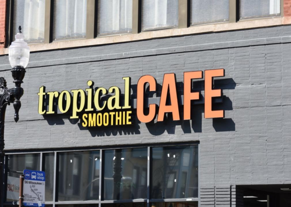 A Tropical Smoothie Cafe next to a CTA bus stop for the 56 Milwaukee.