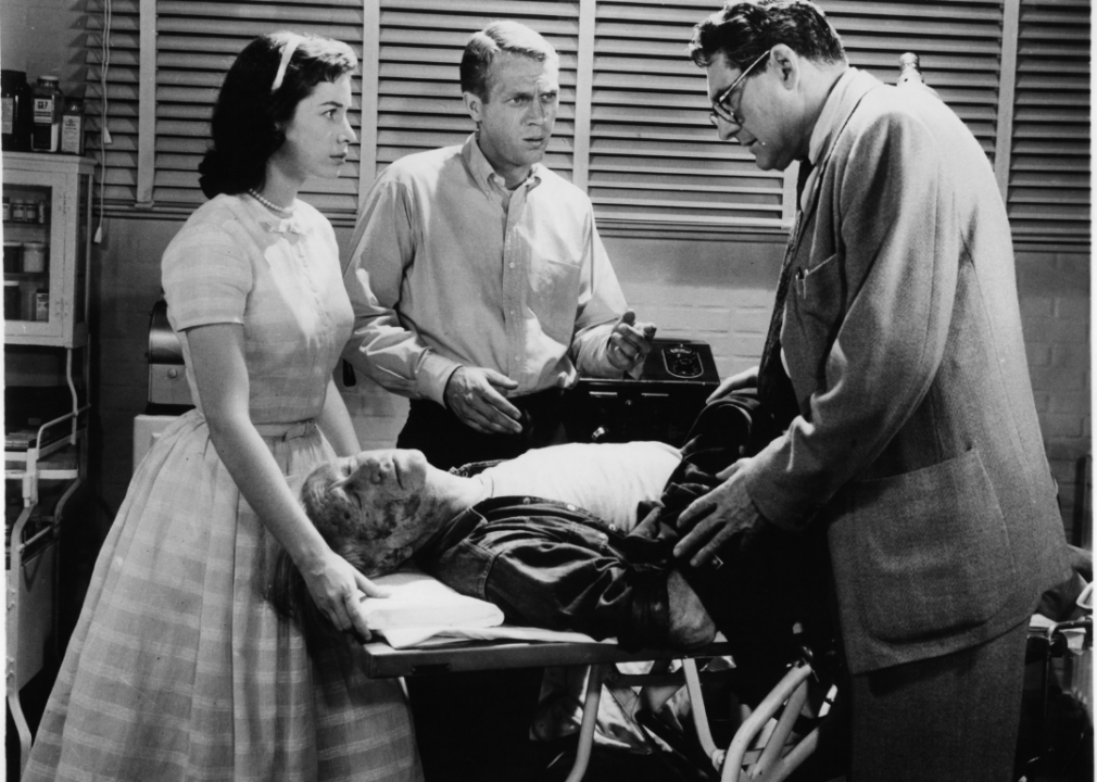 Aneta Corseaut and Steve McQueen present as doctor examines victim of the Blob in a scene from the film The Blob, 1958.