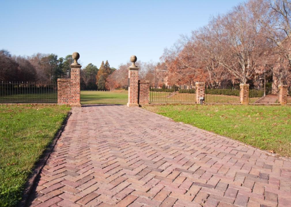 A brick walkway to a garden at William & Mary.