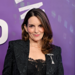 Tina Fey poses for press at SNL50: The Homecoming Concert event.