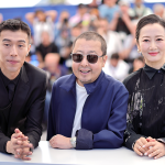 Zhou You, Jia Zhangke and Zhao Tao attend the "Caught By The Tides" Photocall at Cannes.