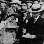 President and Mrs. Coolidge eat ice cream at a garden party for veterans at the White House.