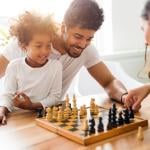 Family playing chess together.